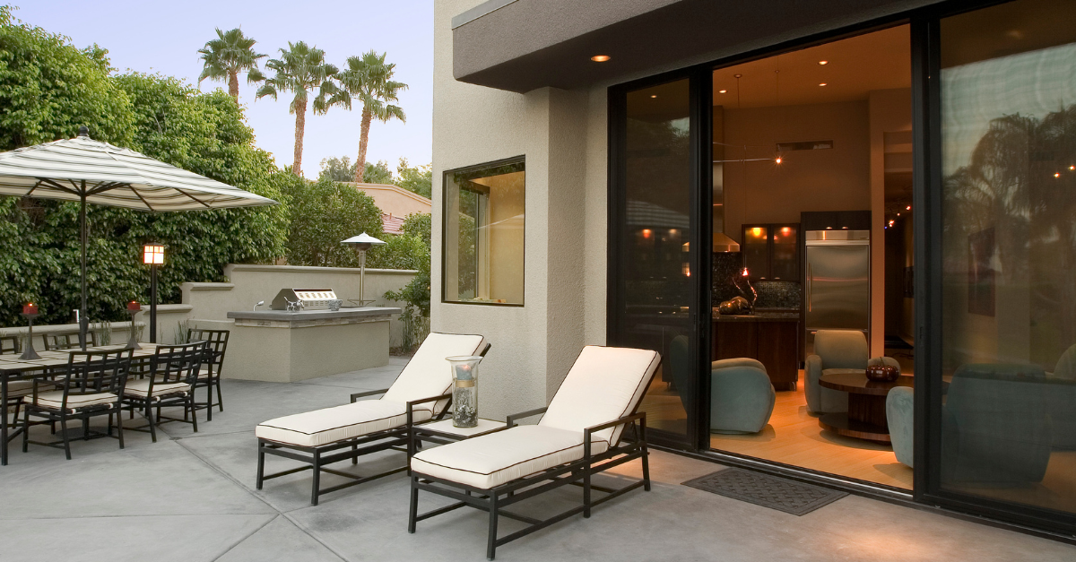 Luxury outdoor patio with two white lounge chairs